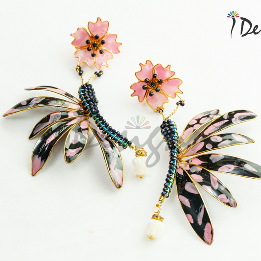 Decorative earrings with floral and leaf designs on a white background, featuring the brand 'iDesign'.