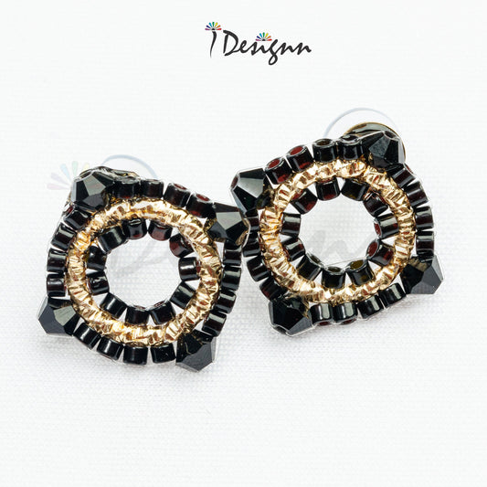 Black and gold beaded earrings on a white background